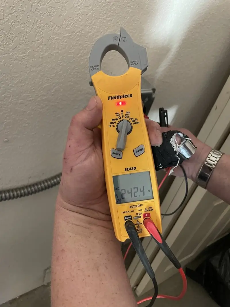 Voltage testing with clamp meter during Electrical Installation Services in Bluffdale